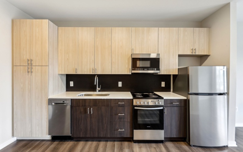 Galley kitchen with oak style cabinets