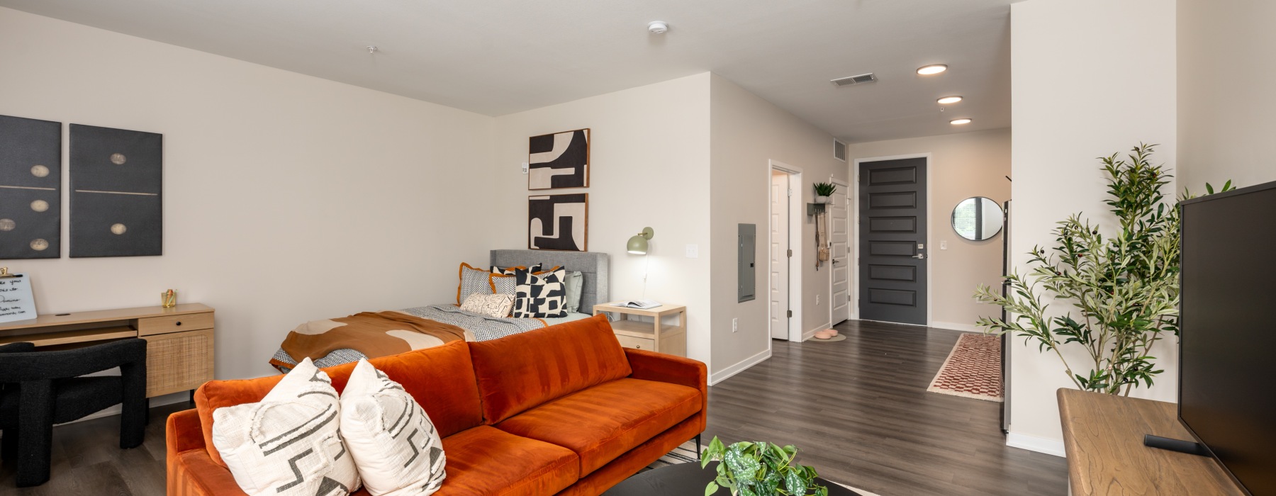 Styled apartment with bright orange couch