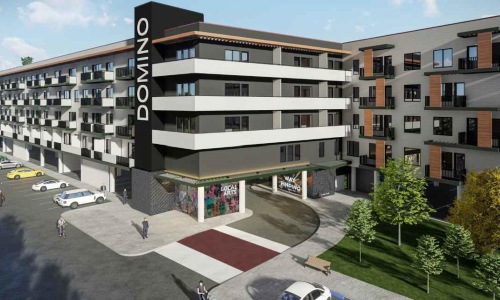 Settle into comfort at The Domino Apartments a building with a parking lot